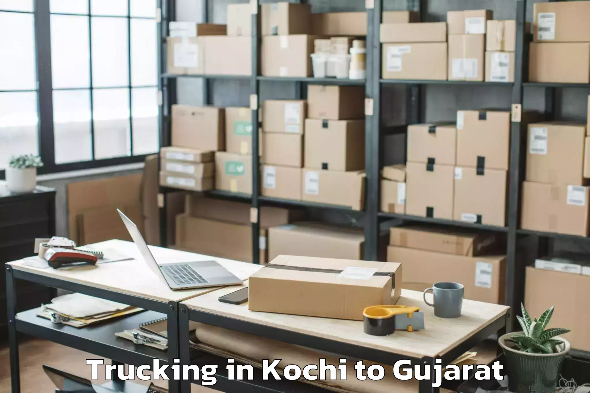 Book Kochi to Abhilashi University Rajkot Trucking Online